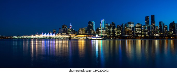 Night Vancouver. Reflection Of City's Skyline.