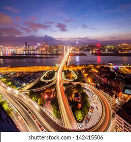 Night View Of The Bridge And City In Shanghai China.