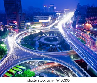 Night View Of The Bridge And City In Shanghai China.