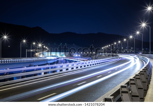 Night view of\
bridge highway in Dalian,\
China