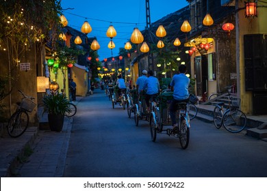 Night view of busy street in Hoi An, Vietnam. Hoi An is the World's Cultural heritage site, famous for mixed cultures and architecture.