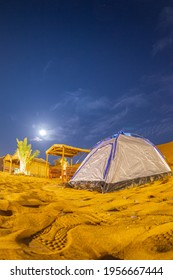 Night View Of Camping Tent And Palm Tree At Desert Area In Dubai