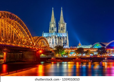 Night view of the cathedral in Cologne and Hohenzollern bridge over Rhein, Germany