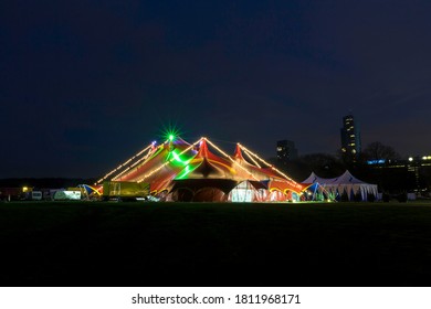 Night view of a circus tent under a blue hours sunset and clean blue sky - Powered by Shutterstock