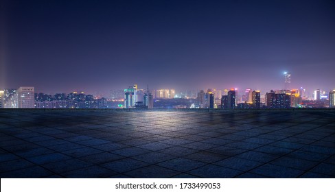 Night view of city lights in front of marble square, Xuzhou, China - Shutterstock ID 1733499053