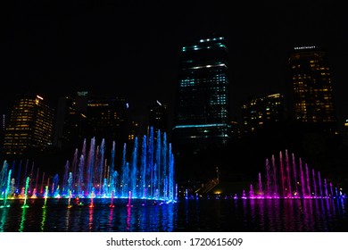 Night view of the dancing multi-colored fountains. Show of Singing Fountains. Kuala Lumpur / Malaysia - 02.13.2020