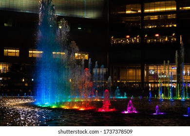 Night view of the dancing multi-colored fountains. Show of Singing Fountains. Kuala Lumpur / Malaysia - 04.17.2020