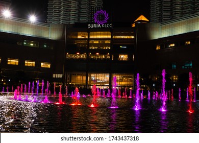 Night view of the dancing multi-colored fountains. Show of Singing Fountains. Kuala Lumpur / Malaysia - 03.17.2020