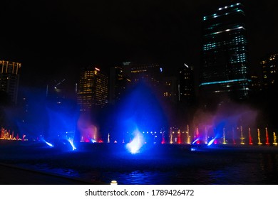 Night view of the dancing multi-colored fountains. Show of Singing Fountains. Kuala Lumpur / Malaysia - 02.27.2020
