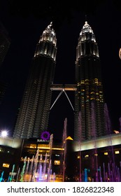 Night view of the dancing multi-colored fountains. Show of Singing Fountains. Kuala Lumpur, Malaysia - 07.18.2020