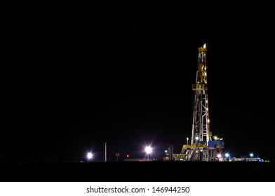 A Night View Of A Derrick Drilling In The Eagle Ford Shale.