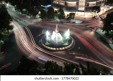 Night View Of Diana The Huntress Fountain And Car Lights Trails On Promenade Of The Reform In Mexico City, Mexico