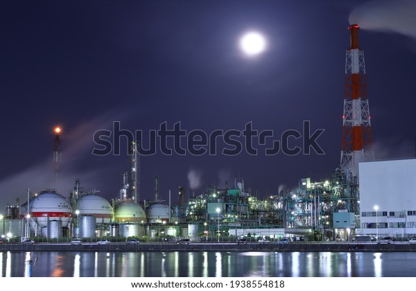 Night view of the\
factory on the shore