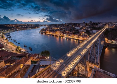 Night View Of The Historic City Of Porto, Portugal With The Luiz I Bridge