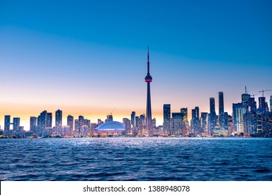 Night view of iconic landmarks and buildings of Toronto city skyline from Centre Island, Canada