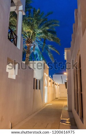 Night view of a narrow alley in Muharraq, Bahrain