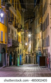 night view of a narrow street leading to the piazza vecchia in the italian city bergamo