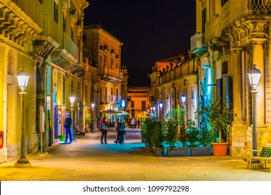 Night view of a narrow street in Ragusa, Sicily, Italy