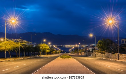 Night View On A Local Street Running To The Red Sea