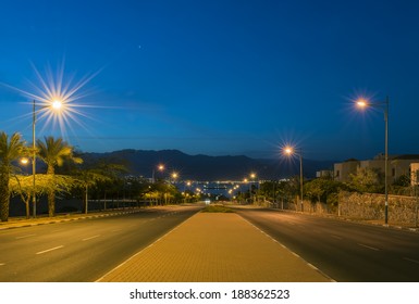 Night View On A Local Street Running To The Red Sea