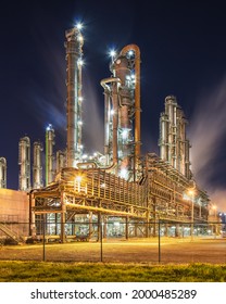 Night view on petrochemical production plant with plumes of smoke, Port of Antwerp