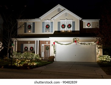 Night View On Residential House Exterior Decorated And Lighted For Christmas Holidays