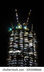 night view on under construction skyscraper. building illumination