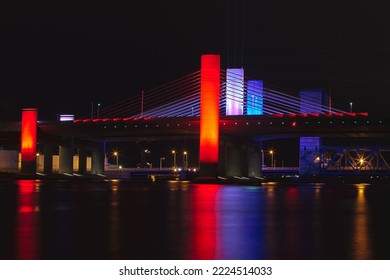 Night view of the Pearl Harbor Memorial Bridge lit up in Red, White and Blue in New Haven, CT