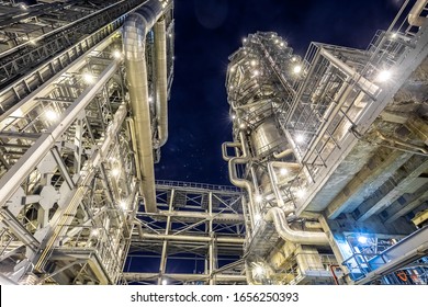 night view of the refinery, distillation columns, blue sky