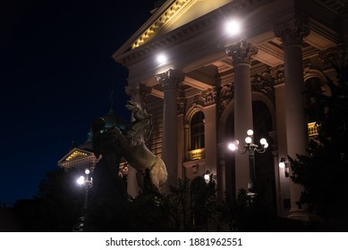 Night View Of A Sculpture Of A Man And A Horse On The Porch Of The National Assembly Of The Republic Of Serbia. A Landmark And Tourist Attraction, Beautiful Architecture. Belgrade, Serbia - 08.02.2020