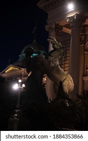 Night View Of A Sculpture Of A Man And A Horse On The Porch Of The National Assembly Of The Republic Of Serbia. A Landmark And Tourist Attraction, Beautiful Architecture. Belgrade, Serbia - 08.02.2020