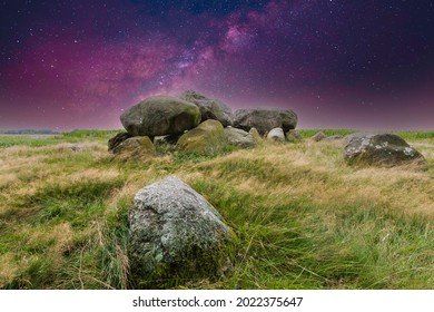 Night view with starry sky in a clear sky of the remains of a Megalithic burial monument, Hunebed D15, consisting of supporting stones and capstones made by people from the Neolithic period