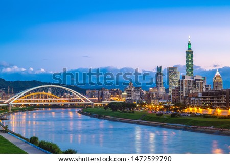 night view of taipei city by the river with taipei 101 tower