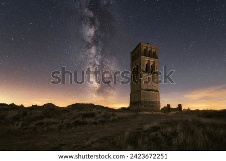 Night view of the tower of the Mudejar church in the depopulated area of ​​Villacreces, Valladolid. Concept depopulation equals climate change