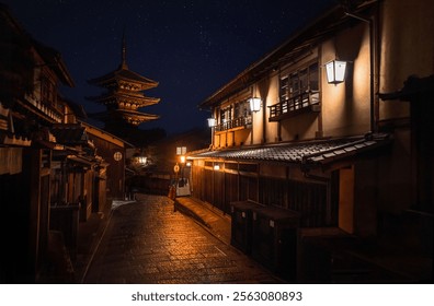 Night view of traditional Japanese street with illuminated pagoda in Kyoto, capturing serene ambiance and architectural beauty. - Powered by Shutterstock