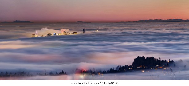 Night View Of Vancouver Emerging From The Fog