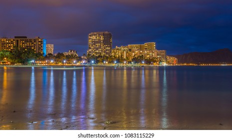Night view of Waikiki Beach and Diamond Head in Honolulu at night in Hawaii, USA