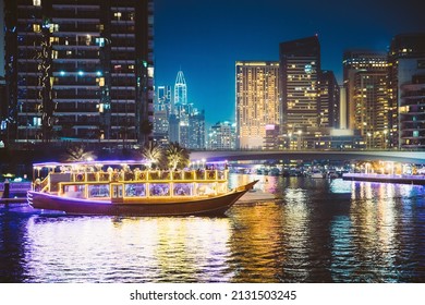 Night Walk On Tourist Boat, Sightseeing Boat Sailing On Dubai Marina. Night View Of Dubai Marina Is District In Dubai, United Arab Emirates. Nighttime. Holidays In United Arab Emirates. Vacation In