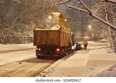 Night Watch: Utility Workers Clean Snow. Equipment Works.