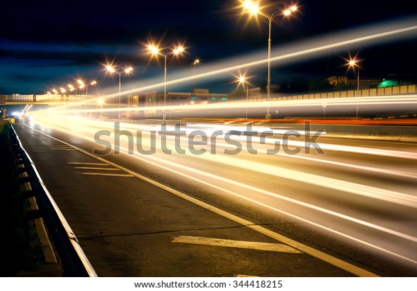 night wide highway with\
moving cars