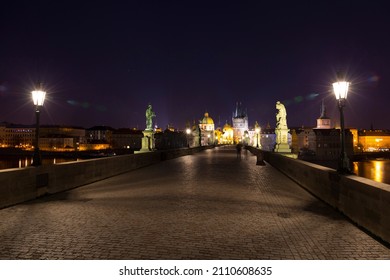 Night winter Prague Old Town from Charles Bridge above the River Vltava with its Statues, Czech Republic - Shutterstock ID 2110608635