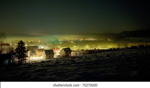 Night Winter View On The Small Town With Mist