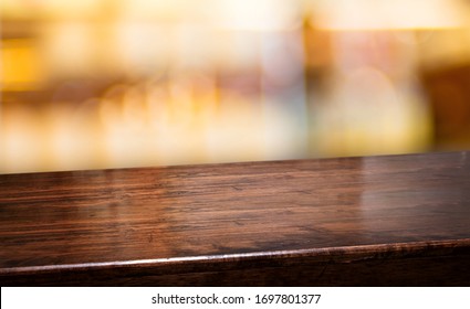 Nightclub Background.Empty Diagonal Brown Wooden Table With Blur Bar Restaurant Bokeh Lights,banner Mockup Template For Display Of Product