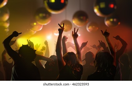 Nightlife And Disco Concept. Young People Are Dancing In Club.