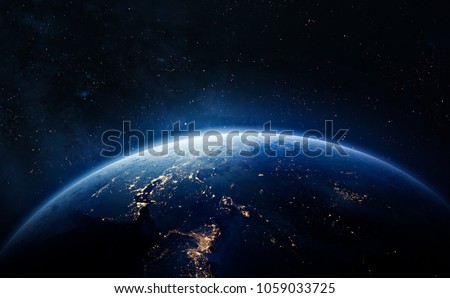 Nightly Earth in the outer space. Abstract wallpaper. City lights on planet. Civilization. Elements of this image furnished by NASA