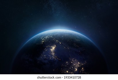 Nightly Earth planet in outer space. City lights on planet. Life of people. Solar system element. Elements of this image furnished by NASA