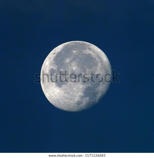 nightly sky with large\
moon