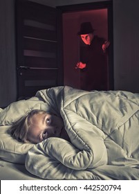 Nightmare. Scared Boy Lying In The Bed While The Masked Stranger Standing In A Doorway