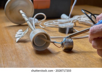 Nightstand Repair. Hands Welding A Lamp Holder