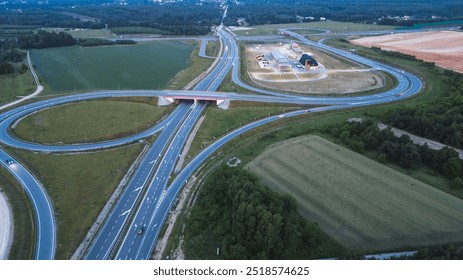 Nighttime aerial of busy freeway intersection - Powered by Shutterstock